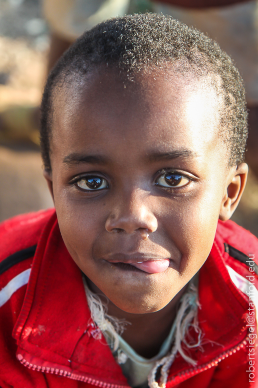 babati boy in red jacket